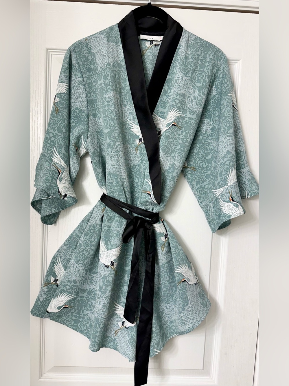 Lush Sage Green Crane Print Wrap Romper with Black Trim